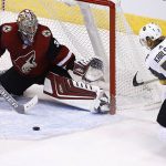Arizona Coyotes goalie Antti Raanta (32) slides over the make a save on a shot by Vegas Golden Knights center William Karlsson (71) during the second period of an NHL hockey game Saturday, Oct. 7, 2017, in Glendale, Ariz. (AP Photo/Ross D. Franklin)