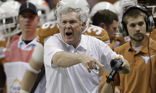 Texas coach Mack Brown argues a call during the second half of the Valero Alamo Bowl NCAA college f...