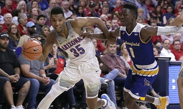 Arizona guard Allonzo Trier (35) drives past Cal State Bakersfield guard Jarkel Joiner during the s...