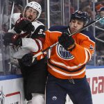 Phoenix Coyotes' Jason Demers (55) is checked by Edmonton Oilers' Milan Lucic (27) during the second period of an NHL hockey game in Edmonton, Alberta, Tuesday, Nov. 28, 2017. (Jason Franson/The Canadian Press via AP)