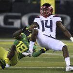 Oregon's Jimmie Swain, left, pulls down Arizona quarterback Khalil Tate during the the fourth quarter of an NCAA college football game, Saturday, Nov. 18, 2017, in Eugene, Ore. (AP Photo/Chris Pietsch)