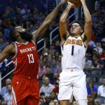 Phoenix Suns guard Devin Booker (1) tries to shoot over Houston Rockets guard James Harden (13) during the second half of an NBA basketball game Thursday, Nov. 16, 2017, in Phoenix. The Rockets won 142-116. (AP Photo/Ross D. Franklin)
