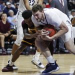 Arizona State's Shannon Evans II, left, and Xavier's Sean O'Mara, right, battle for the ball during the first period of an NCAA college basketball game Friday, Nov. 24, 2017, in Las Vegas. (AP Photo/John Locher)