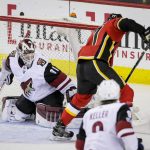 Calgary Flames' Mark Jankowski scores on Arizona Coyotes goalie Scott Wedgewood during the second period of an NHL hockey game Thursday, Nov. 30, 2017, in Calgary, Alberta. (Lyle Aspinall/The Canadian Press via AP)