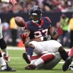 Houston Texans running back D'Onta Foreman (27) fumbles the ball as he is hit by Arizona Cardinals nose tackle Xavier Williams (94) during the first half of an NFL football game, Sunday, Nov. 19, 2017, in Houston. (AP Photo/Eric Christian Smith)