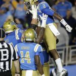 UCLA wide receiver Jordan Lasley is congratulated after scoring against Arizona State during the second half of an NCAA college football game in Pasadena, Calif., Saturday, Nov. 11, 2017. UCLA won 44-37.
 (AP Photo/Chris Carlson)