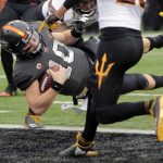 Oregon State quarterback Darell Garreston (10) dives into the end zone for a touchdown against Arizona State in the second half of an NCAA college football game, in Corvallis, Ore., Saturday, Nov. 18, 2017. (AP Photo/Timothy J. Gonzalez)