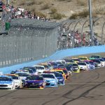 Drivers take the green flag at the start of a NASCAR Cup Series auto race at Phoenix International Raceway, Sunday, Nov. 12, 2017, in Avondale, Ariz. (AP Photo/Ross D. Franklin)