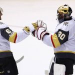 Vegas Golden Knights goalie Malcolm Subban (30) celebrates a win against the Arizona Coyotes with Golden Knights defenseman Colin Miller (6) after an NHL hockey game Saturday, Nov. 25, 2017, in Glendale, Ariz. The Golden Knights defeated the Coyotes 4-2. (AP Photo/Ross D. Franklin)