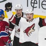 Arizona Coyotes' Christian Fischer (36) celebrates with teammate Derek Stepan (21) after scoring against the Montreal Canadiens as Canadiens' Tomas Plekanec looks on during third-period NHL hockey game action in Montreal, Thursday, Nov. 16, 2017. (Graham Hughes/The Canadian Press via AP)