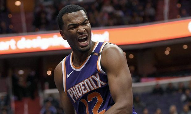Phoenix Suns forward TJ Warren (12) reacts during the second half of an NBA basketball game against...