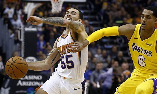 Phoenix Suns guard Mike James (55) tries to drive past Los Angeles Lakers guard Jordan Clarkson dur...