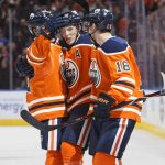Edmonton Oilers' Matthew Benning, from left, Ryan Nugent-Hopkins and Ryan Strome celebrate an overtime goal against the Phoenix Coyotes in an NHL hockey game in Edmonton, Alberta, Tuesday, Nov. 28, 2017. The Oilers won, 3-2, in overtime. (Jason Franson/The Canadian Press via AP)