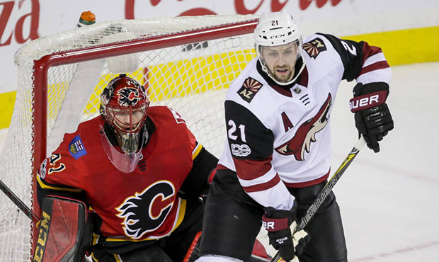 Arizona Coyotes' Derek Stepan screens Calgary Flames goalie Mike Smith during the second period of ...