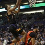 Phoenix Suns forward TJ Warren, left, shoots over New Orleans Pelicans forward Anthony Davis in the second half during an NBA basketball game, Friday, Nov 24, 2017, in Phoenix. (AP Photo/Rick Scuteri)