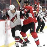 Ottawa Senators' Alexandre Burrows (14) checks Arizona Coyotes' Christian Fischer (36) during the first period of an NHL hockey game in Ottawa, Saturday, Nov. 18, 2017. (Justin Tang/The Canadian Press via AP)