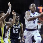 Kansas State guard Barry Brown (5) drives the lane past Northern Arizona defenders Jojo Anderson, left, and Ruben Fuamba (55) during the second half of an NCAA college basketball game in Manhattan, Kan., Monday, Nov. 20, 2017. (AP Photo/Orlin Wagner)
