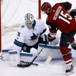 San Jose Sharks goalie Martin Jones (31) makes a save on a shot by Arizona Coyotes center Brad Richardson (15) during the second period of an NHL hockey game Wednesday, Nov. 22, 2017, in Glendale, Ariz. (AP Photo/Ross D. Franklin)