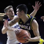 Northern Arizona forward Brooks Debisschop, right, is covered by Kansas State forward Dean Wade, left, during the first half of an NCAA college basketball game in Manhattan, Kan., Monday, Nov. 20, 2017. (AP Photo/Orlin Wagner)