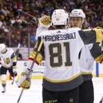 Vegas Golden Knights center William Karlsson, right, celebrates his goal against the Arizona Coyotes with Golden Knights' Jonathan Marchessault (81) as Coyotes' Anthony Duclair, left, pauses on the ice during the second period of an NHL hockey game Saturday, Nov. 25, 2017, in Glendale, Ariz. (AP Photo/Ross D. Franklin)