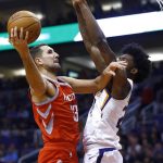 Houston Rockets forward Ryan Anderson (33) gets off a shot as Phoenix Suns forward Josh Jackson defends during the first half of an NBA basketball game Thursday, Nov. 16, 2017, in Phoenix. (AP Photo/Ross D. Franklin)