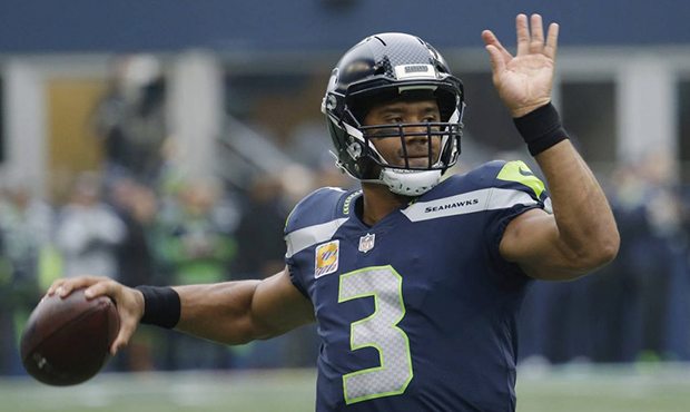 Seattle Seahawks quarterback Russell Wilson passes during warmups before an NFL football game again...
