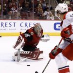 Arizona Coyotes goalie Antti Raanta (32) makes a save on a shot by Carolina Hurricanes right wing Justin Williams (14) during the first period of an NHL hockey game Saturday, Nov. 4, 2017, in Glendale, Ariz. (AP Photo/Ross D. Franklin)