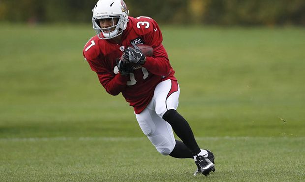 Running back D.J. Foster of the Arizona Cardinals runs with the ball during an NFL training session...