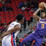 Phoenix Suns forward Marquese Chriss (0) takes a shot against Detroit Pistons forward Stanley Johnson (7) during the first half of an NBA basketball game Wednesday, Nov. 29, 2017 in Detroit. (AP Photo/Duane Burleson)