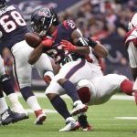 Houston Texans running back D'Onta Foreman (27) fumbles the ball as he is hit by Arizona Cardinals nose tackle Xavier Williams (94) during the first half of an NFL football game, Sunday, Nov. 19, 2017, in Houston. (AP Photo/Eric Christian Smith)