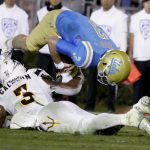 UCLA quarterback Josh Rosen is tackled by Arizona State linebacker DJ Calhoun during the second half of an NCAA college football game in Pasadena, Calif., Saturday, Nov. 11, 2017. UCLA won 44-37. (AP Photo/Chris Carlson)