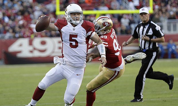 Arizona Cardinals quarterback Drew Stanton (5) scrambles from San Francisco 49ers defensive end DeF...