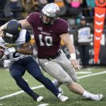 Montana linebacker Connor Strahm (10) tackles Northern Arizona running back Nate Stinson (2) for a loss of yards in an NCAA college football game Saturday, Nov. 4, 2017, in Missoula, Mont. (AP Photo/Patrick Record)