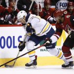 Buffalo Sabres right wing Kyle Okposo (21) works against Arizona Coyotes left wing Anthony Duclair (10) for the puck during the first period of an NHL hockey game Thursday, Nov. 2, 2017, in Glendale, Ariz. The Sabres won 5-4. (AP Photo/Ross D. Franklin)