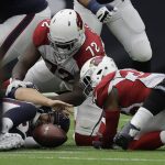 Houston Texans quarterback Tom Savage (3) fumbles during the first half of an NFL football game against the Arizona Cardinals, Sunday, Nov. 19, 2017, in Houston. Arizona Cardinals cornerback Rudy Ford (30) recovered the ball. (AP Photo/David J. Phillip)