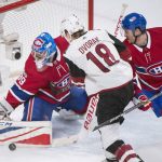 Montreal Canadiens goaltender Charlie Lindgren makes a save against Arizona Coyotes' Christian Dvorak as Canadiens' Jeff Petry defends during second-period NHL hockey game action in Montreal, Thursday, Nov. 16, 2017. (Graham Hughes/The Canadian Press via AP)