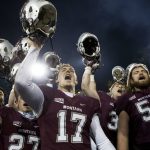Montana wide receiver Makena Simis (17) leads the team in singing their fight song after playing Northern Arizona in an NCAA college football game Saturday, Nov. 4, 2017, in Missoula, Mont. (AP Photo/Patrick Record)