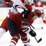 Arizona Coyotes right wing Mario Kempe (29) battles Carolina Hurricanes center Jordan Staal (11) during a face off in the first period of an NHL hockey game Saturday, Nov. 4, 2017, in Glendale, Ariz. (AP Photo/Ross D. Franklin)