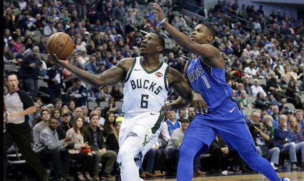 Milwaukee Bucks guard Eric Bledsoe (6) drives to the basket for a shot after getting past Dallas Ma...