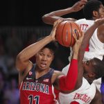 Arizona forward Ira Lee (11) drives to the basket through Southern Methodist defense of Ben Emelogu, lower right, and Jimmy Whitt during an NCAA college basketball game Thursday, Nov. 23, 2017, in the Battle 4 Atlantis tournament in Paradise Island, Bahamas. (Tim Aylen/Bahamas Visual Services Photo via AP)