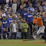 Houston Astros' George Springer watches his two-run home run off Los Angeles Dodgers starting pitcher Yu Darvish, of Japan, during the second inning of Game 7 of baseball's World Series Wednesday, Nov. 1, 2017, in Los Angeles. (AP Photo/Mark J. Terrill)