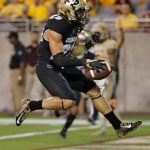 Colorado running back Phillip Lindsay (23) scores a touchdown against Arizona State during the first half of an NCAA college football game, Saturday, Nov. 4, 2017, in Tempe, Ariz. (AP Photo/Matt York)