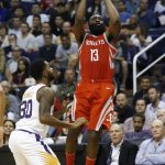 Houston Rockets guard James Harden (13) shoots in front of Phoenix Suns guard Troy Daniels (30) during the first half of an NBA basketball game Thursday, Nov. 16, 2017, in Phoenix. (AP Photo/Ross D. Franklin)
