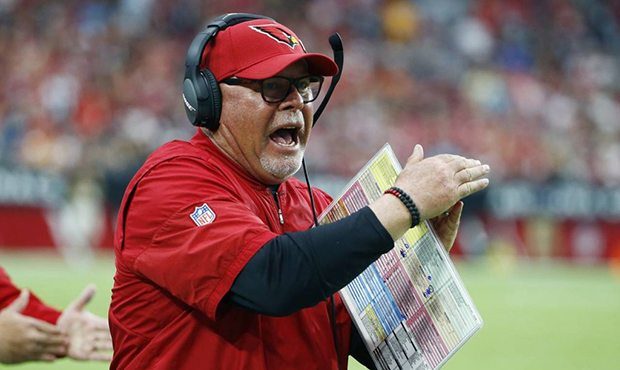 FILE - In this Oct. 15, 2017, file photo, Arizona Cardinals head coach Bruce Arians tries to call a...
