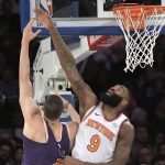 New York Knicks center Kyle O'Quinn (9) blocks a shot by Phoenix Suns center Alex Len during the second quarter of an NBA basketball game Friday, Nov. 3, 2017, at Madison Square Garden in New York. (AP Photo/Bill Kostroun)