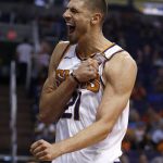 Phoenix Suns center Alex Len celebrates a score and being fouled by the Brooklyn Nets during the second half of an NBA basketball game Monday, Nov. 6, 2017, in Phoenix. The Nets defeated the Suns 98-92. (AP Photo/Ross D. Franklin)