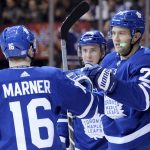 Toronto Maple Leafs left wing James van Riemsdyk (25) celebrates his goal with centre Mitchell Marner (16) and Toronto Maple Leafs centre Tyler Bozak during second period NHL hockey action against the Arizona Coyotes in Toronto on Monday, Nov. 20, 2017. (Nathan Denette/The Canadian Press via AP)
