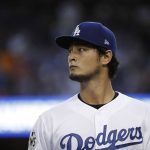 Los Angeles Dodgers starting pitcher Yu Darvish walks to the dugout during the first inning of Game 7 of baseball's World Series against the Houston Astros Wednesday, Nov. 1, 2017, in Los Angeles. (AP Photo/Matt Slocum)