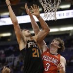 Phoenix Suns center Alex Len (21) shoots over New Orleans Pelicans center Omer Asik in the second half during an NBA basketball game, Friday, Nov 24, 2017, in Phoenix. (AP Photo/Rick Scuteri)