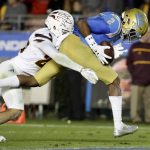 UCLA wide receiver Jordan Lasley, right, scores past Arizona State defensive back Cody French during the second half of an NCAA college football game in Pasadena, Calif., Saturday, Nov. 11, 2017. UCLA won 44-37. (AP Photo/Chris Carlson)